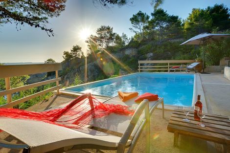 Long_Beach_Villa_sunset_with_the_local_robola_wine